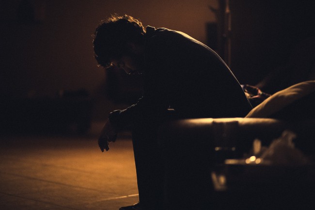 Man sat in the dark